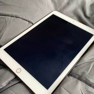 Apple Tablet with White Frame and Black Screen